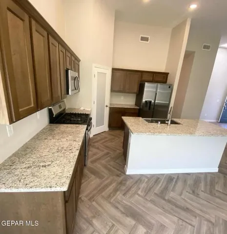 a living room with a couch and a dresser