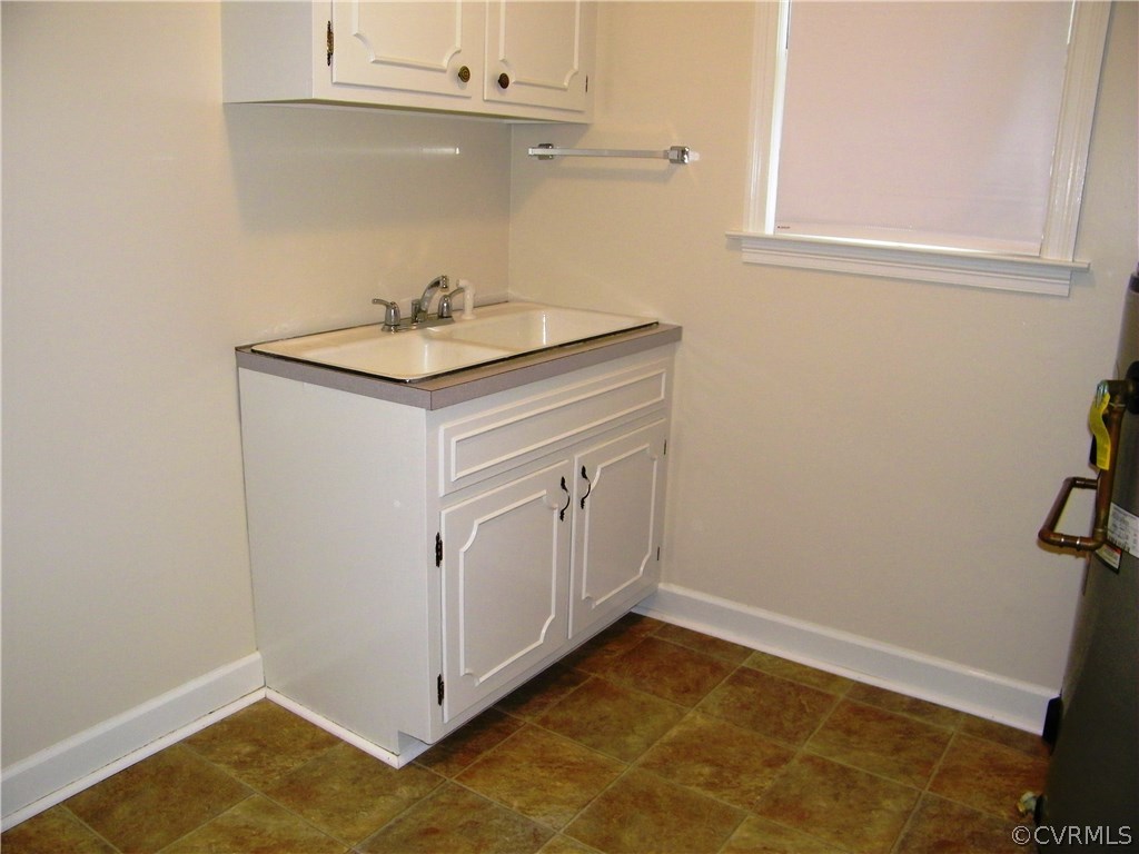 13401 Inge Road Chester, VA 23836 - Photo 18 of 24 a bathroom with a sink and a mirror
