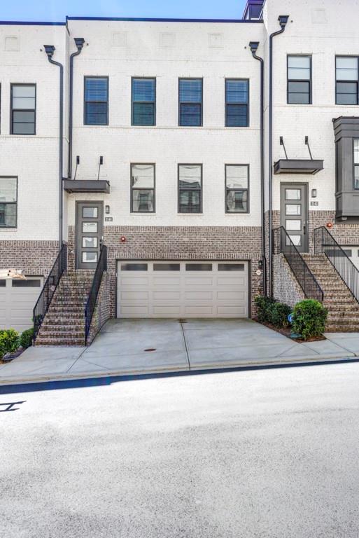a view of a brick building with many windows