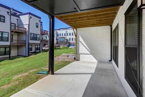 a view of a porch with a garden