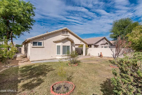 a view of front of house with a yard
