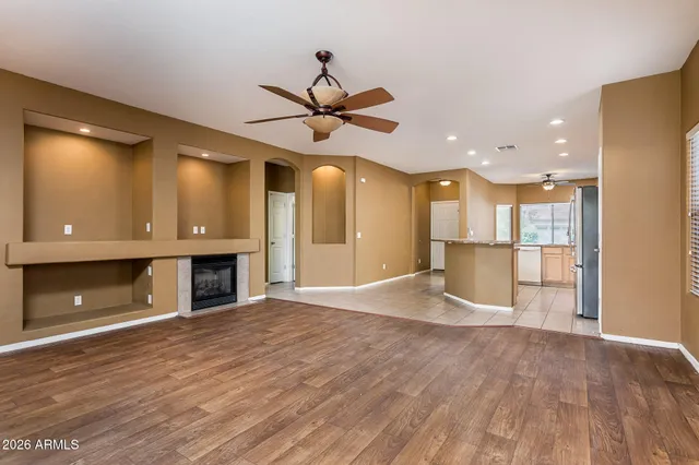a view of a kitchen with a sink and a refrigerator