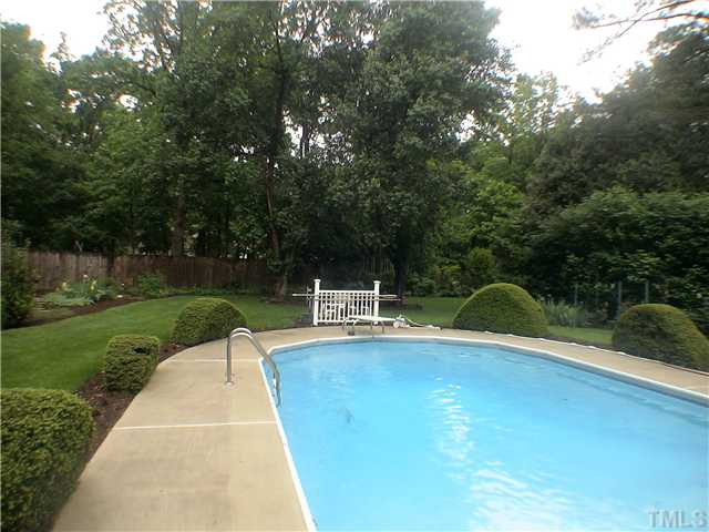 404 Chowning Place Raleigh, NC 27614 - Photo 20 of 25 Sparkling pool surrounded by arc shaped shrubs