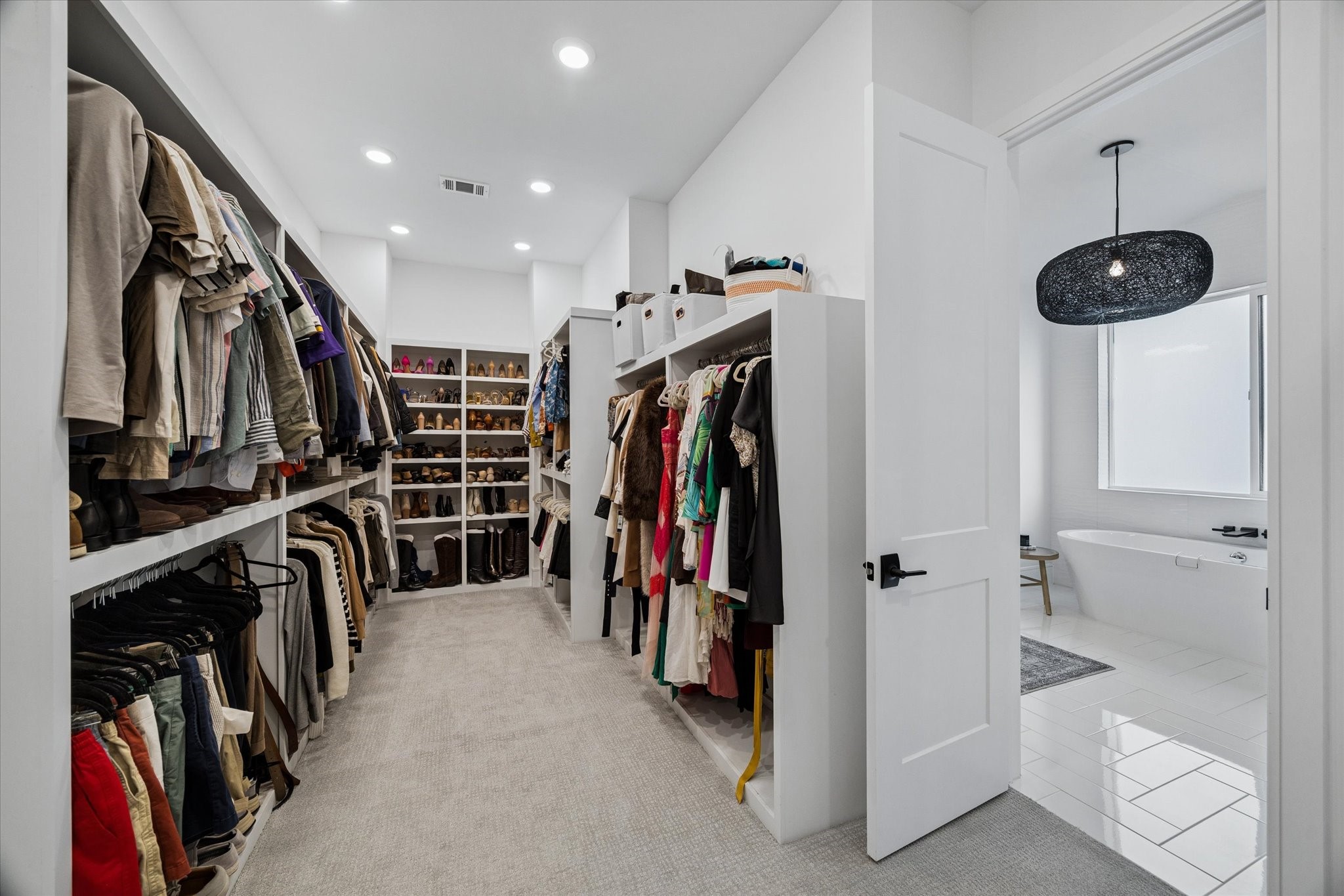 1661 Bingle Road Houston, TX 77055 - Photo 20 of 33 primary closet with an abundance of built ins.