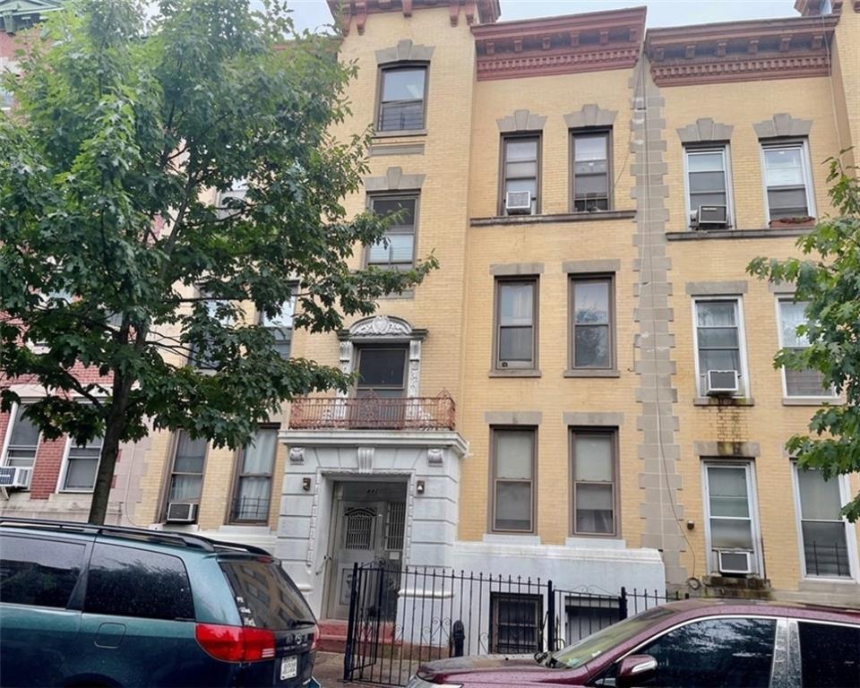 448 40th Street Brooklyn, NY 11232 - Photo 2 of 7 a front view of a building with parking space