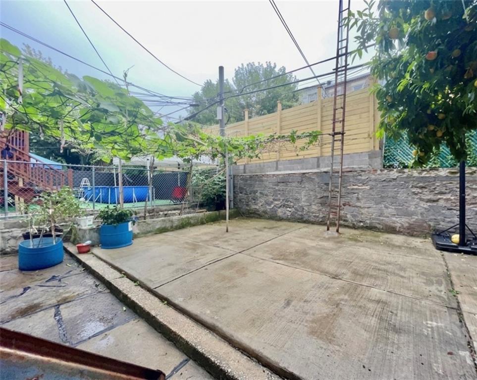 448 40th Street Brooklyn, NY 11232 - Photo 3 of 7 a view of a backyard with sitting area