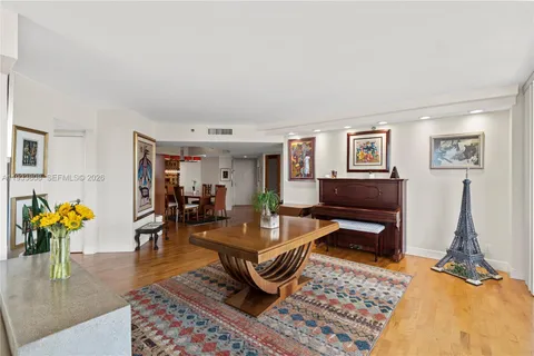 a kitchen with stainless steel appliances kitchen island a stove a sink a refrigerator and cabinets