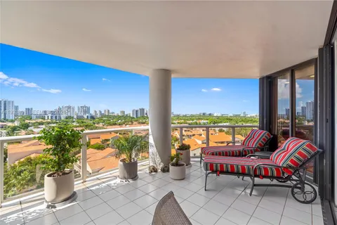 a bathroom with a tub a sink and mirror