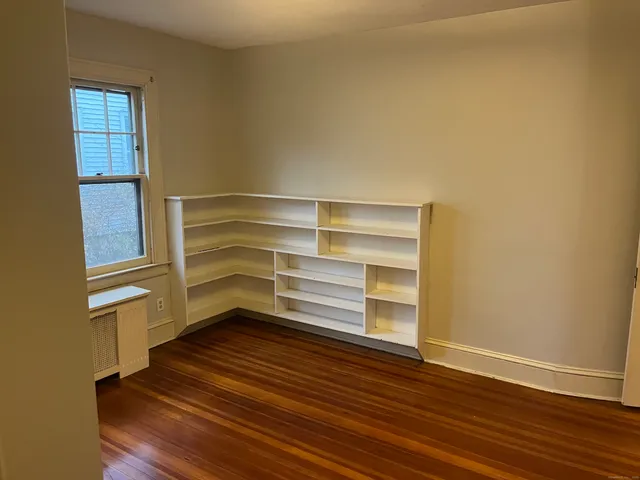 a storage room with wooden floor