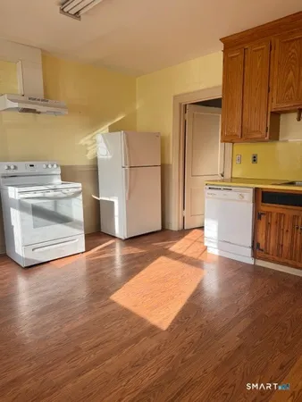 a kitchen with a sink and a stove top oven