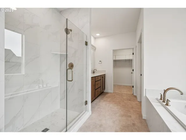 a bathroom with a granite countertop sink mirror and double