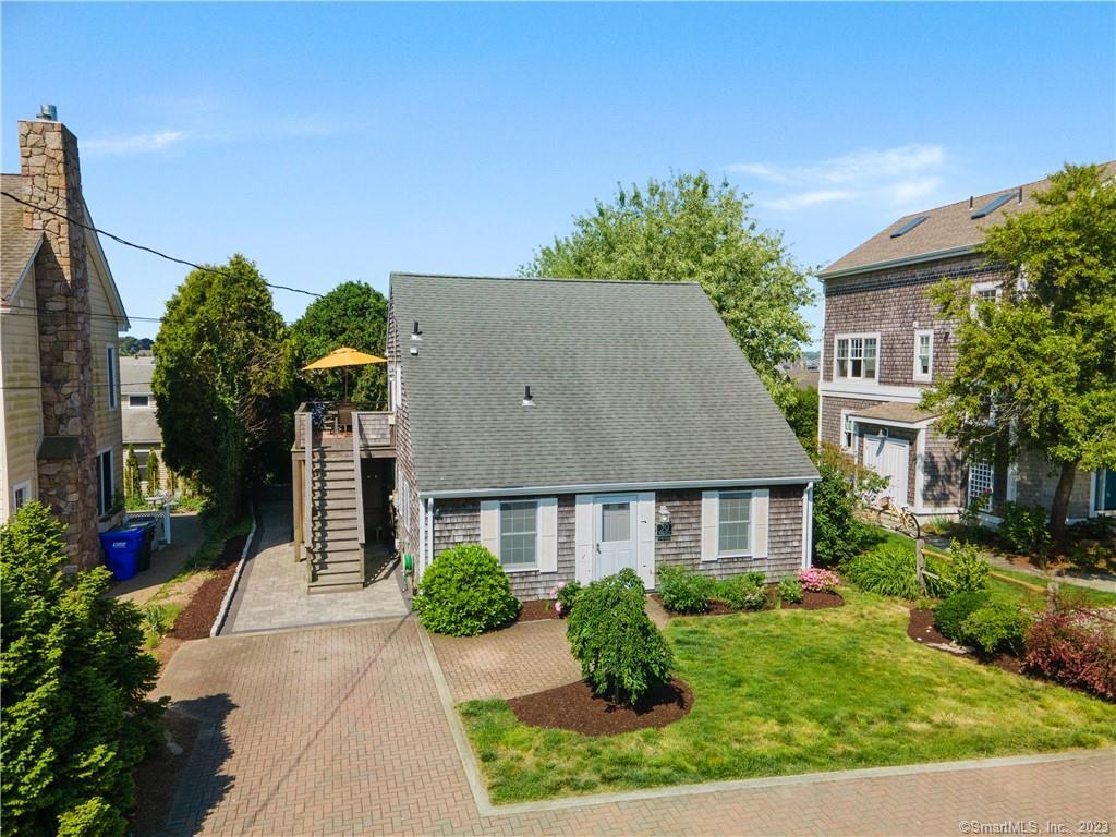a aerial view of a house with a yard
