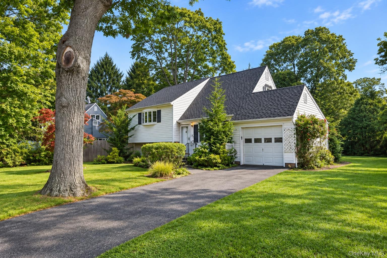 69 Circuit Road Bellport, NY 11713 - Photo 2 of 23 One car attached garage.