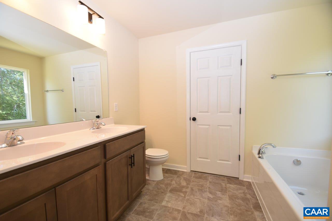 142 Jordan Store Road, Unit LOT 27 Kents Store, VA 23084 - Photo 11 of 13 a bathroom with a sink a toilet and shower