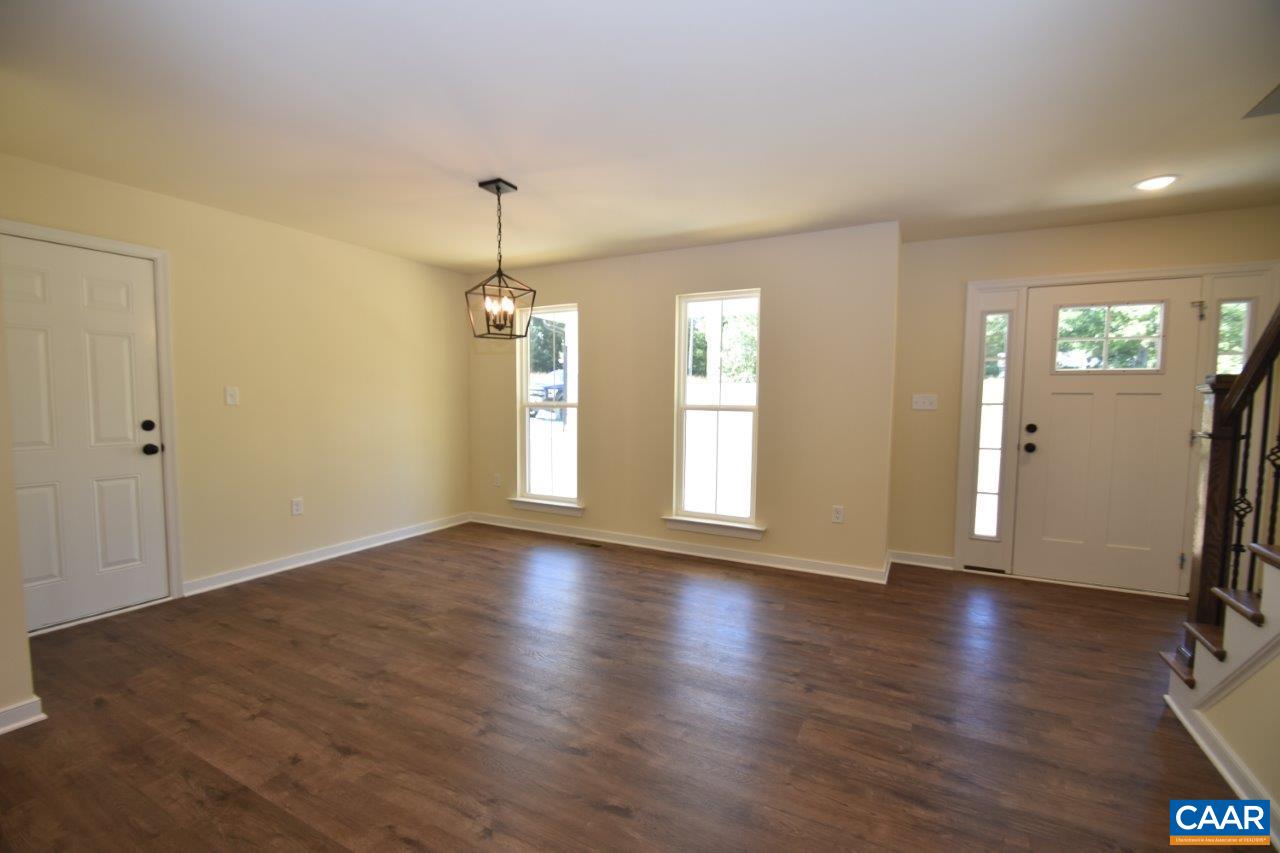 142 Jordan Store Road, Unit LOT 27 Kents Store, VA 23084 - Photo 2 of 13 an empty room with wooden floor and windows