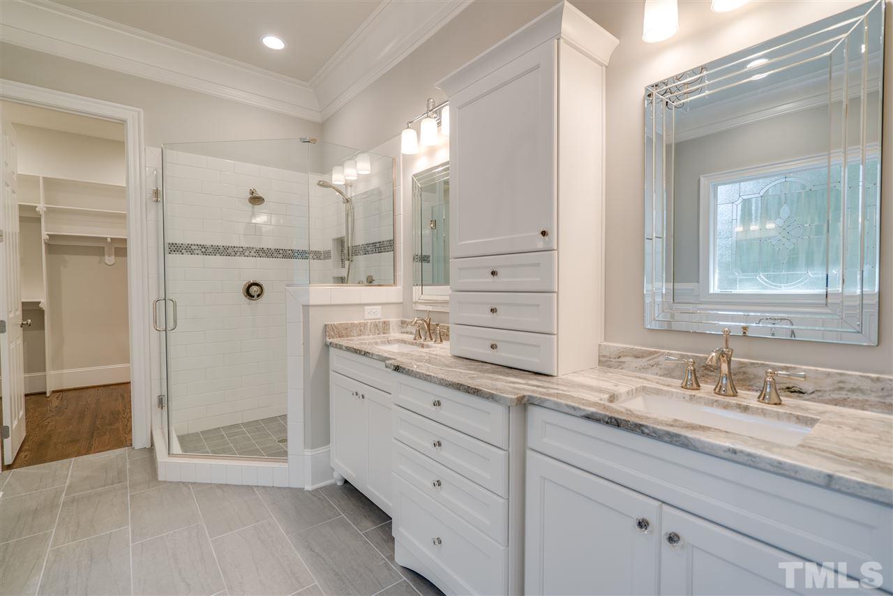 1508 Duplin Road Raleigh, NC 27607 - Photo 17 of 25 a bathroom with a granite countertop sink mirror and shower