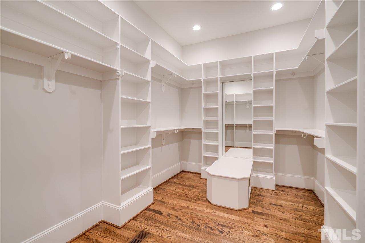 1508 Duplin Road Raleigh, NC 27607 - Photo 20 of 25 a room with a chair and a potted plant