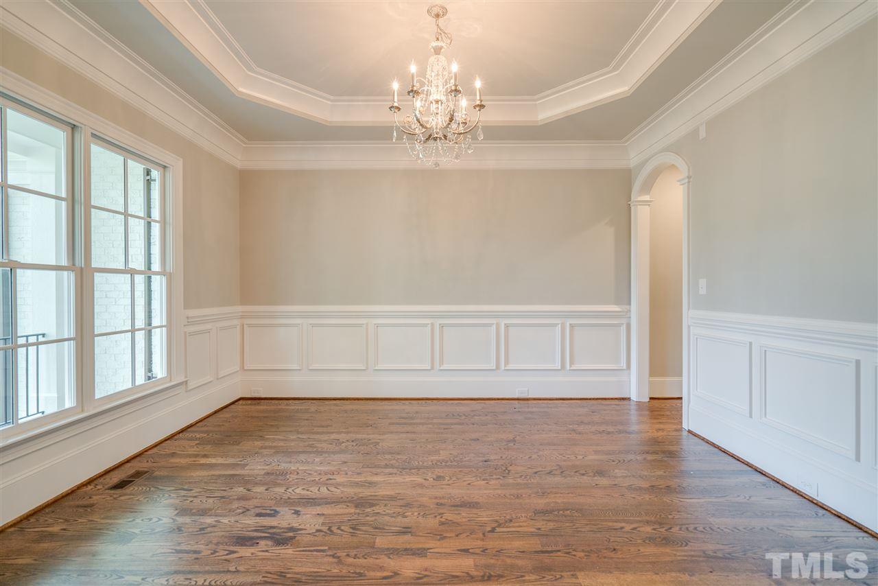 1508 Duplin Road Raleigh, NC 27607 - Photo 4 of 25 wooden floor in an empty room with a window