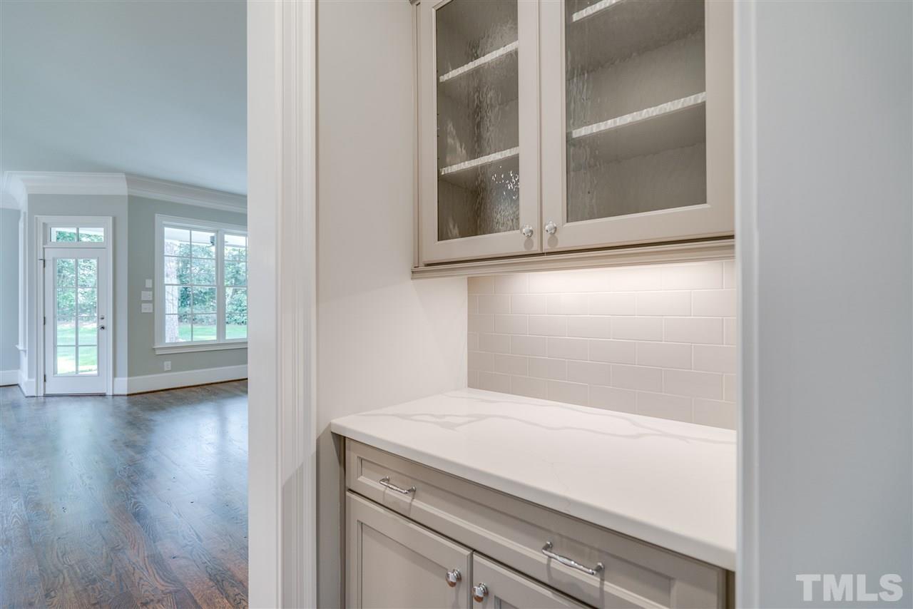 1508 Duplin Road Raleigh, NC 27607 - Photo 5 of 25 a view of empty room with wooden floor and fan
