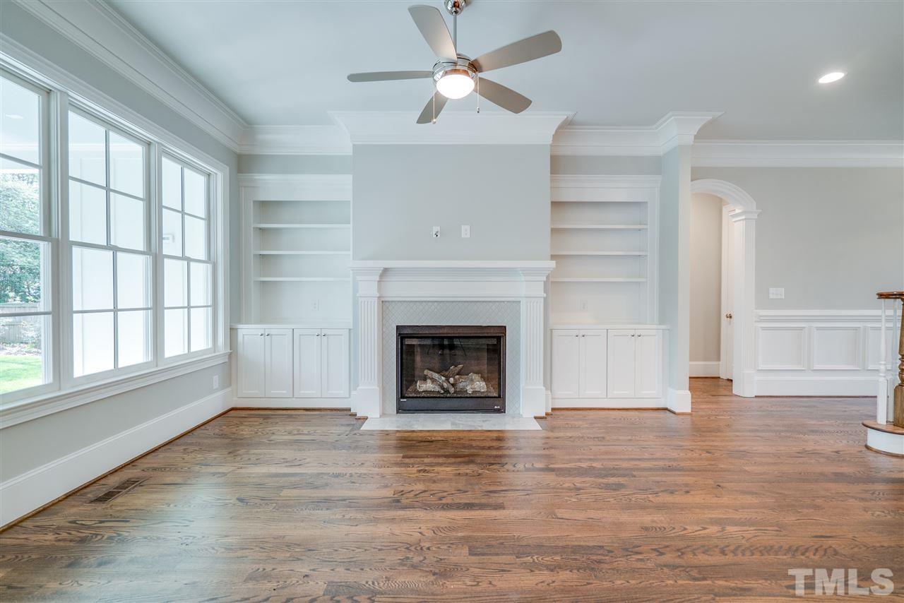 1508 Duplin Road Raleigh, NC 27607 - Photo 7 of 25 wooden floor fireplace and windows in an empty room