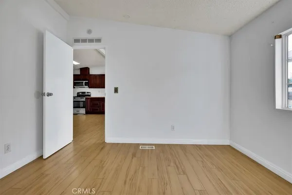 a view of storage and utility room in wooden floor