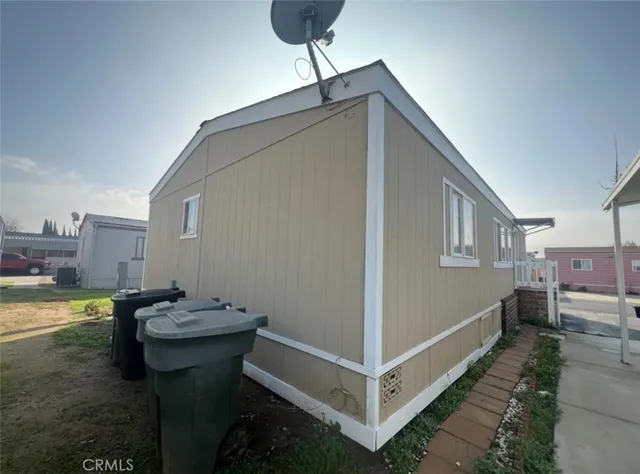 a view of a house with pool table and chairs