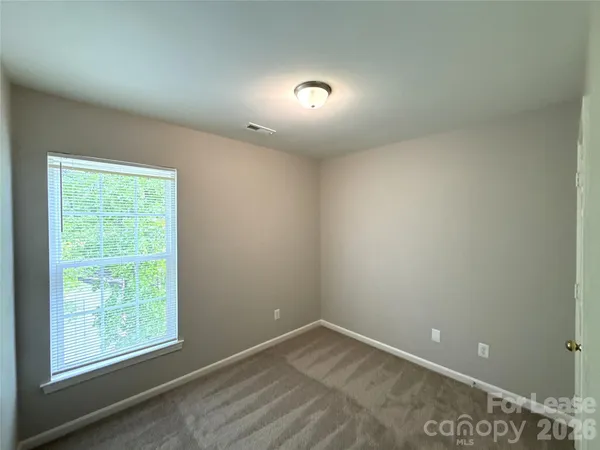a bathroom with a double vanity sink mirror and toilet