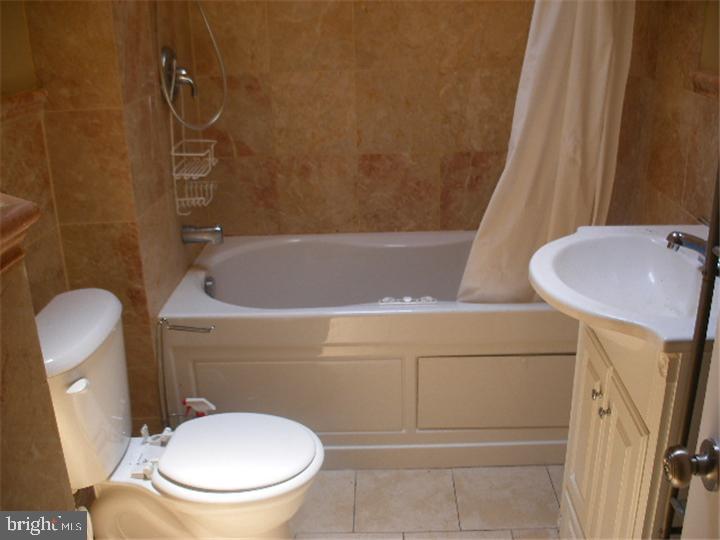 555 Millbank Road Upper Darby, PA 19082 - Photo 11 of 14 a bathroom with a sink and a toilet