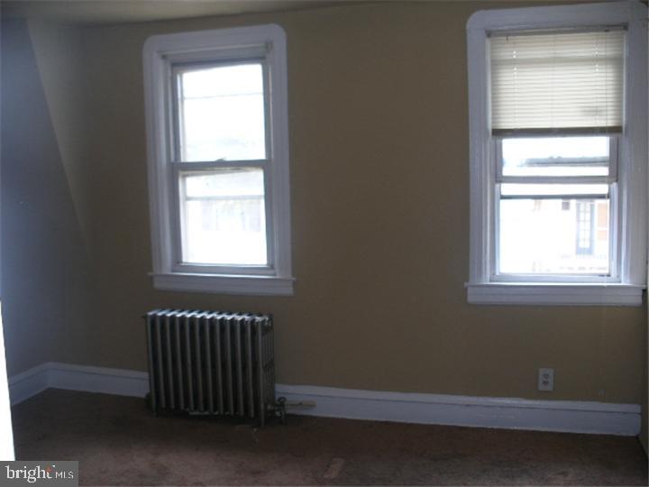 555 Millbank Road Upper Darby, PA 19082 - Photo 13 of 14 an empty room with a window