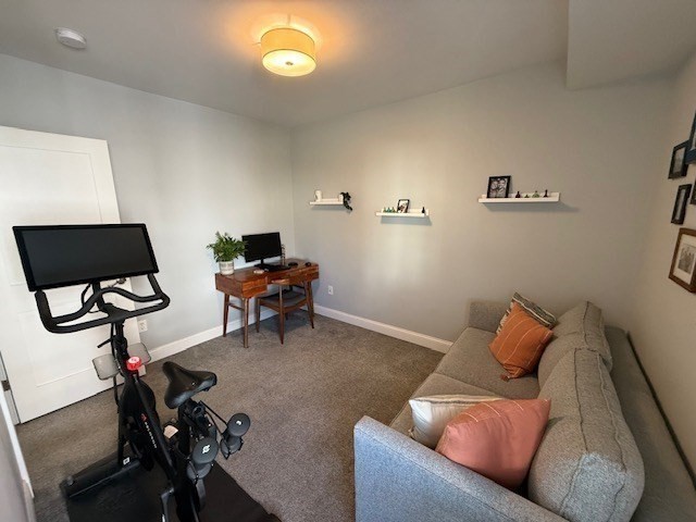 4 Cushing Street, Unit A Amesbury, MA 01913 - Photo 12 of 19 a living room with furniture and a flat screen tv