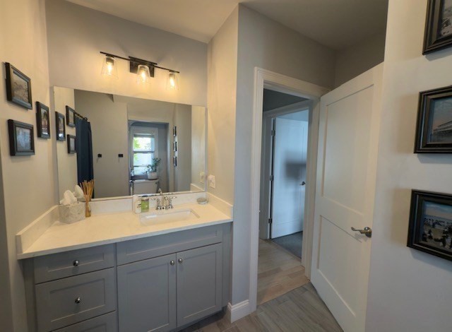 4 Cushing Street, Unit A Amesbury, MA 01913 - Photo 13 of 19 a bathroom with a double vanity sink and a mirror