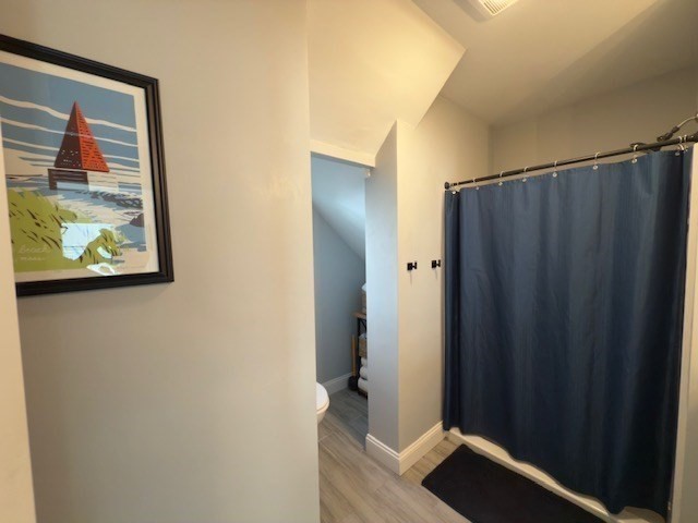 4 Cushing Street, Unit A Amesbury, MA 01913 - Photo 14 of 19 a view of a hallway with paintings on the wall