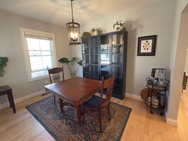 4 Cushing Street, Unit A Amesbury, MA 01913 - Photo 8 of 19 a view of a dining room with furniture window and wooden floor