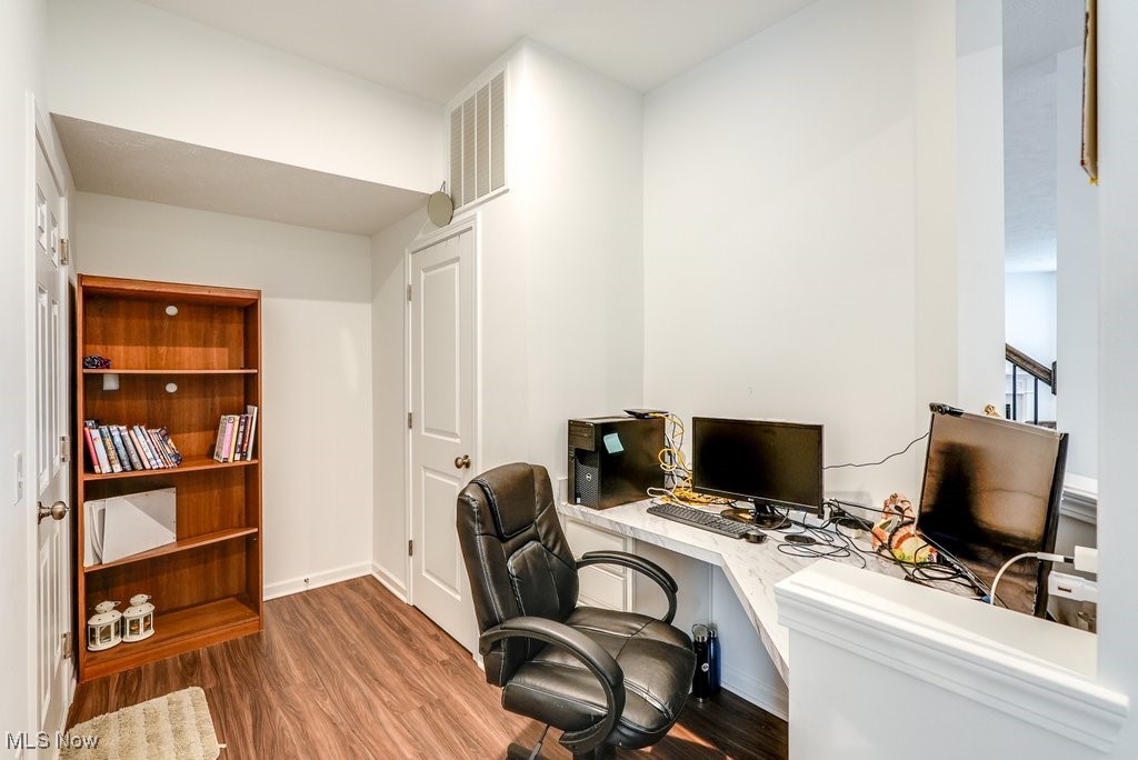 765 River Run Road Aurora, OH 44202 - Photo 19 of 35 Office featuring dark hardwood / wood-style floors and built in desk