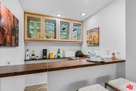 a kitchen with a sink a stove and a window