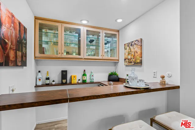 a kitchen with a sink a stove and a window