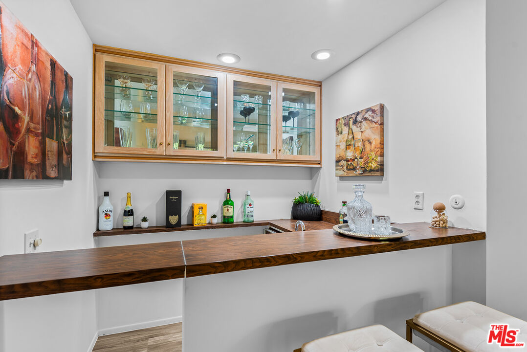 4736 Park Encino Lane, Unit 215 Encino, CA 91436 - Photo 12 of 37 a kitchen with a sink a stove and a window