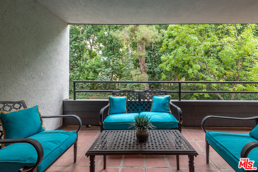 4736 Park Encino Lane, Unit 215 Encino, CA 91436 - Photo 22 of 37 a living room with furniture and a window