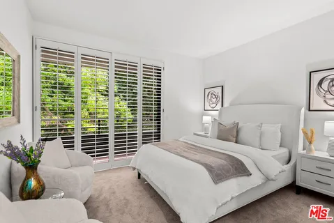 a bathroom with a sink double vanity and mirror