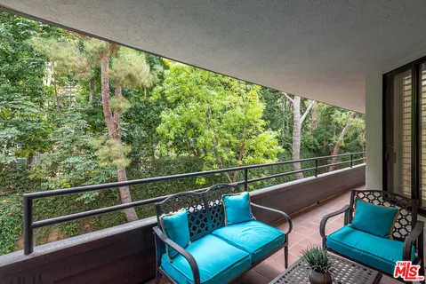 a view of balcony with wooden floor