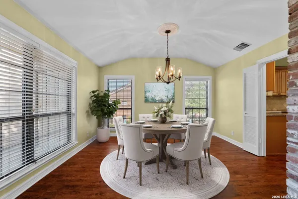 a view of a dining room with furniture window and wooden floor