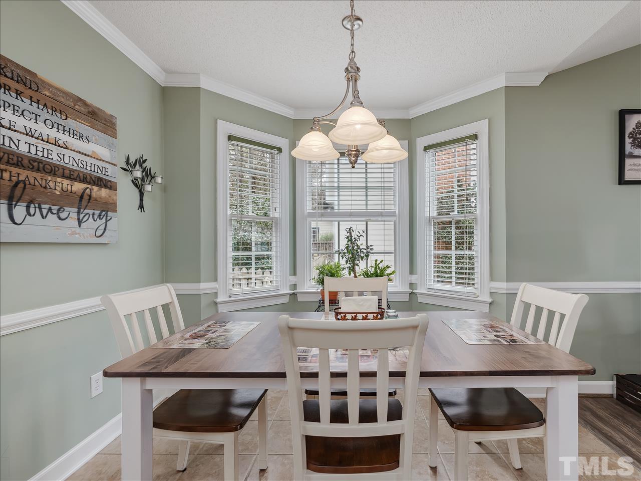 4408 Emmit Drive Raleigh, NC 27604 - Photo 11 of 38 a view of a dining room with furniture window and outside view