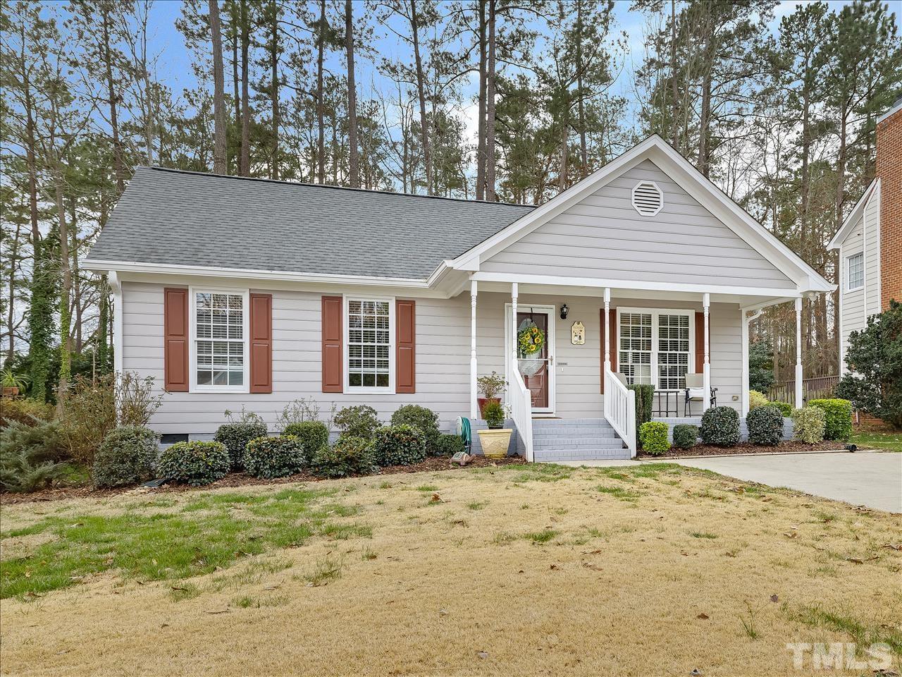 4408 Emmit Drive Raleigh, NC 27604 - Photo 17 of 38 a front view of a house with garden and porch