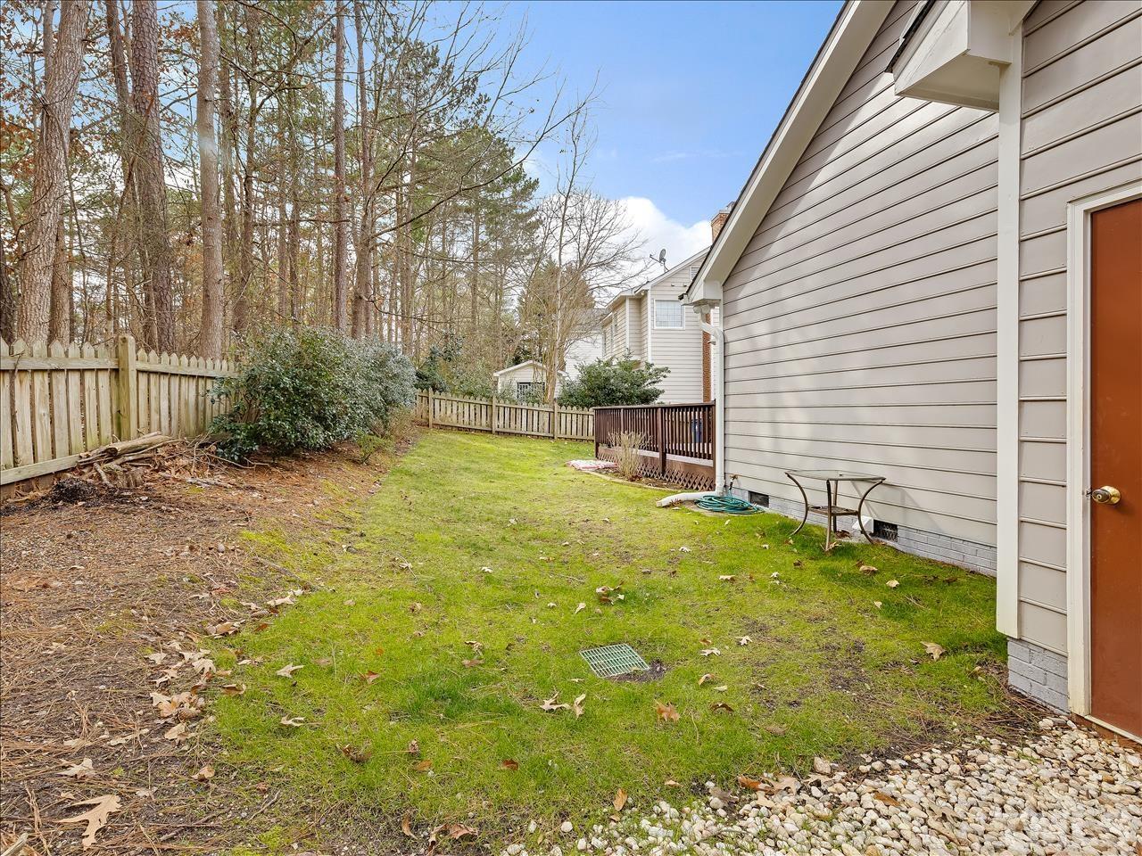 4408 Emmit Drive Raleigh, NC 27604 - Photo 2 of 38 a backyard of a house with table and chairs