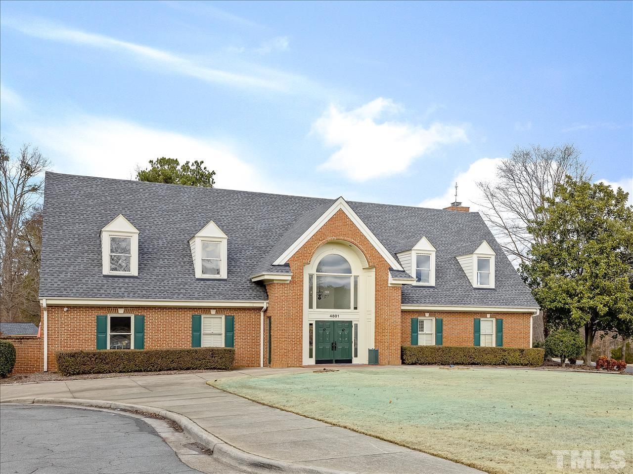 4408 Emmit Drive Raleigh, NC 27604 - Photo 26 of 38 a front view of a house with a garden