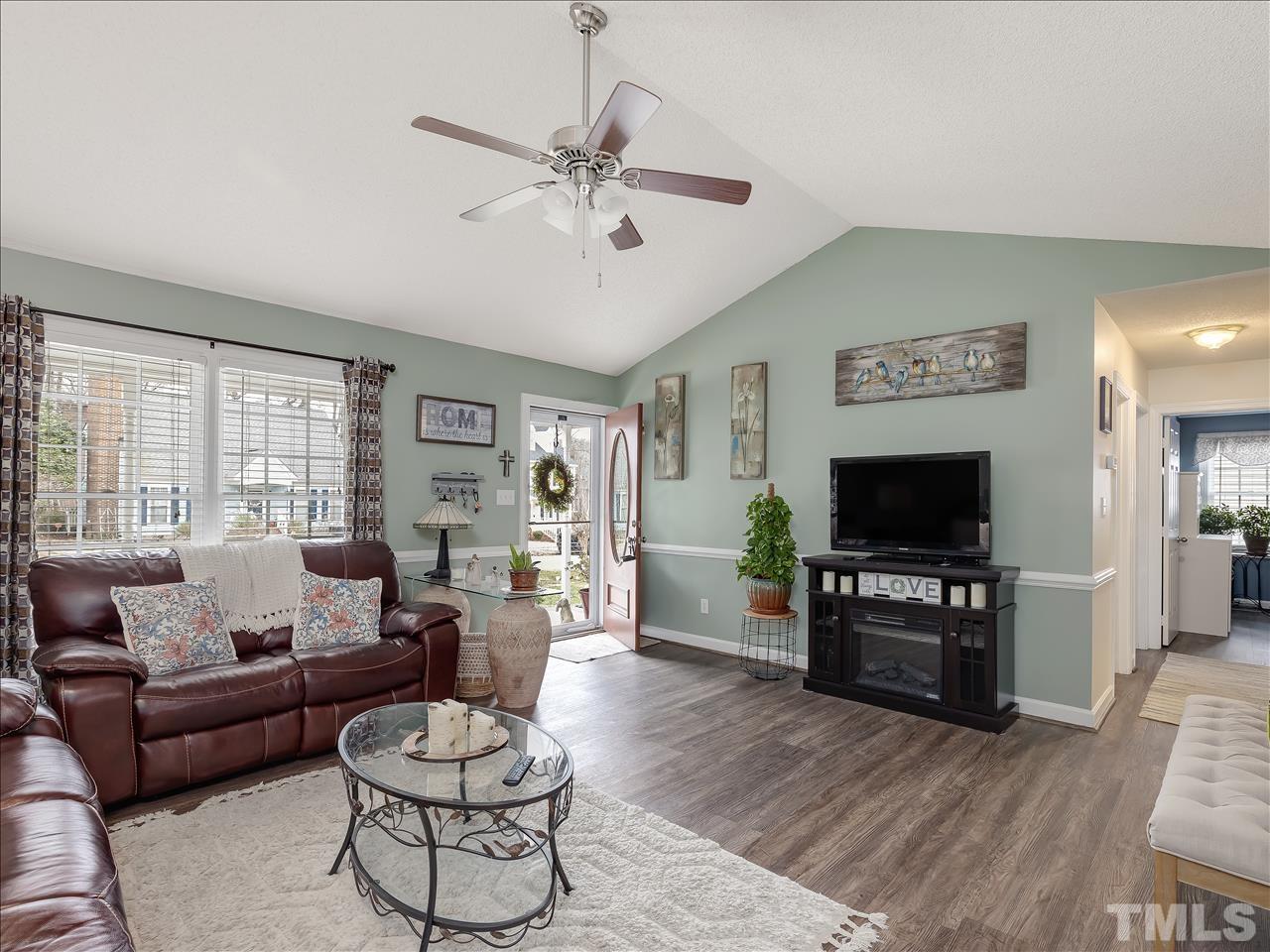 4408 Emmit Drive Raleigh, NC 27604 - Photo 38 of 38 a living room with furniture and a flat screen tv