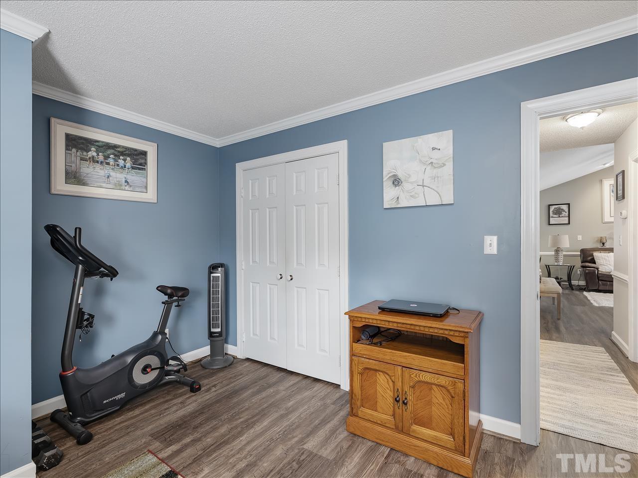 4408 Emmit Drive Raleigh, NC 27604 - Photo 6 of 38 a view of a room with gym equipment