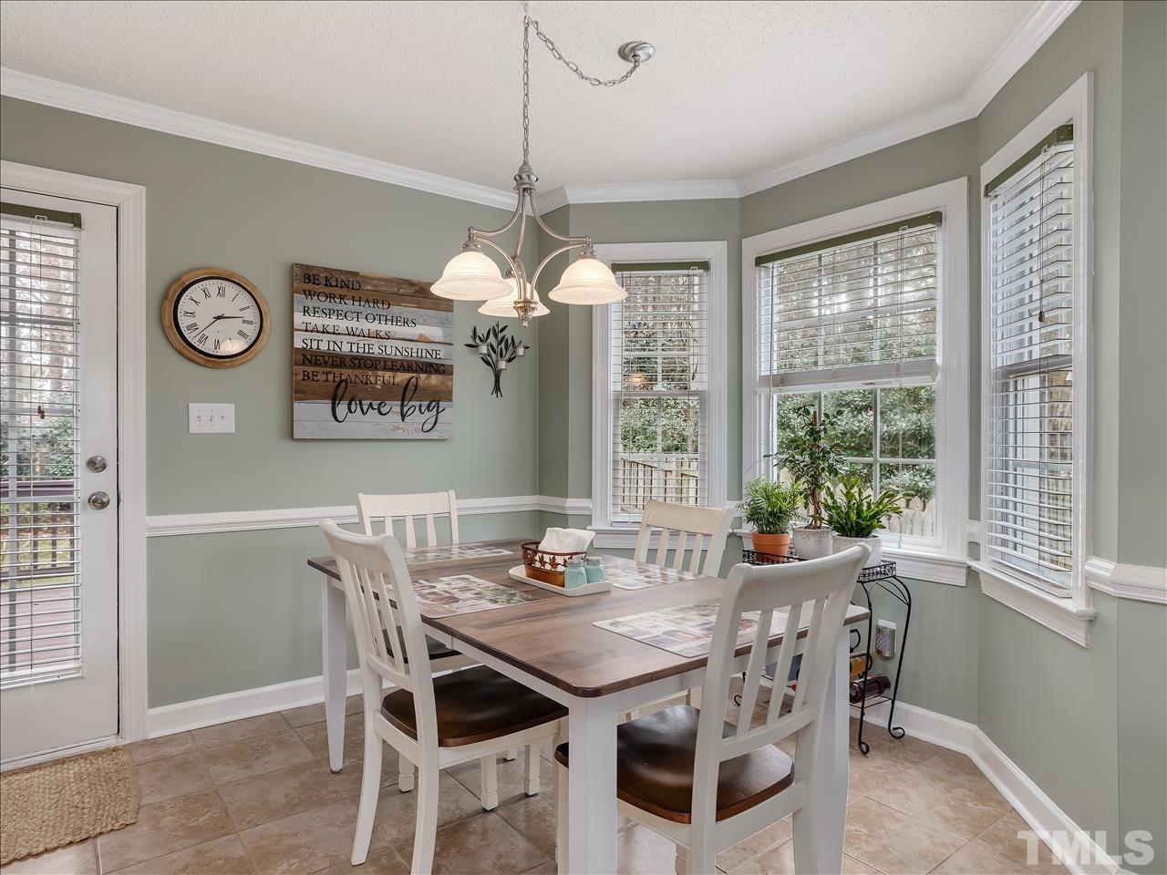 4408 Emmit Drive Raleigh, NC 27604 - Photo 10 of 38 a view of a dining room with furniture window and outside view