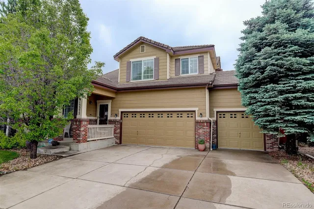 a front view of a house with a garage