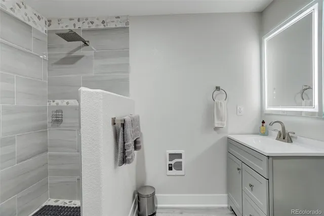a bathroom with a sink and mirror